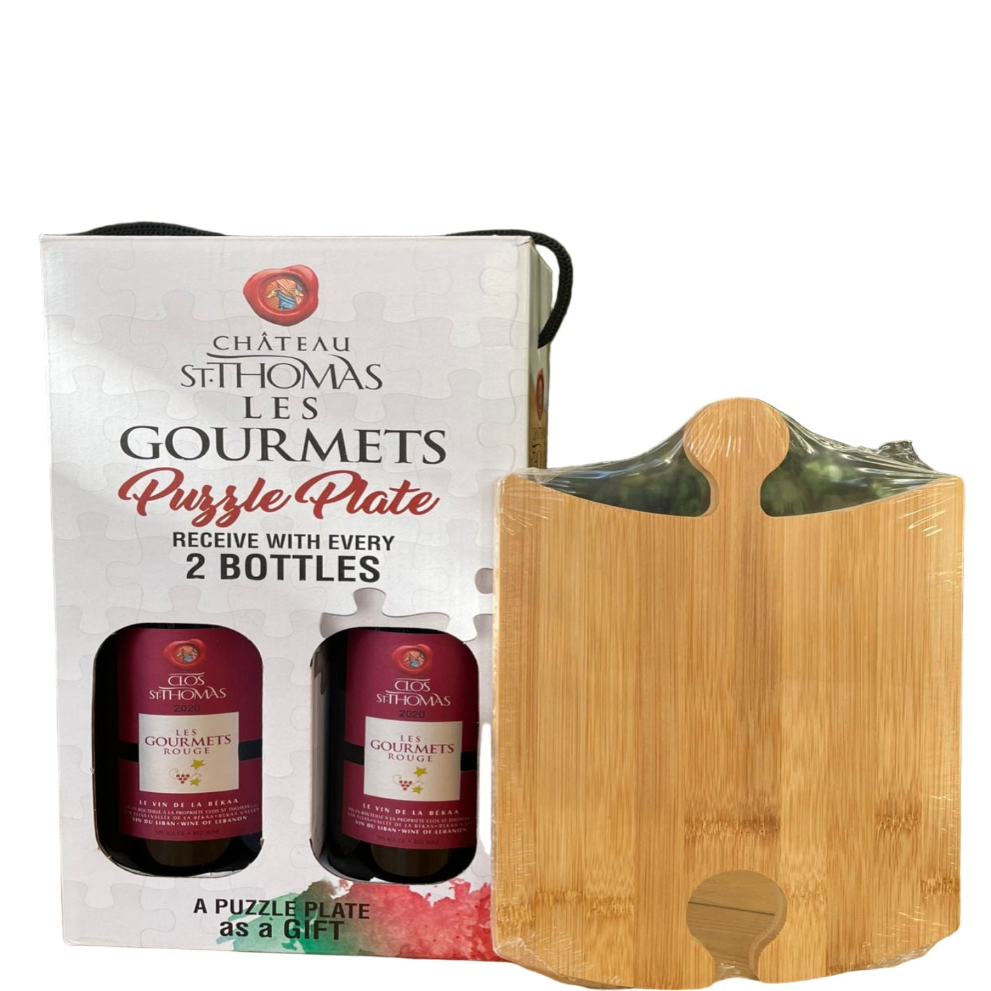 Château Sithomas Le 5 Gourmets puzzle plate packaging with a wooden puzzle plate against a natural background.